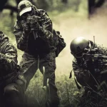 Strikeball players in helmets, guns