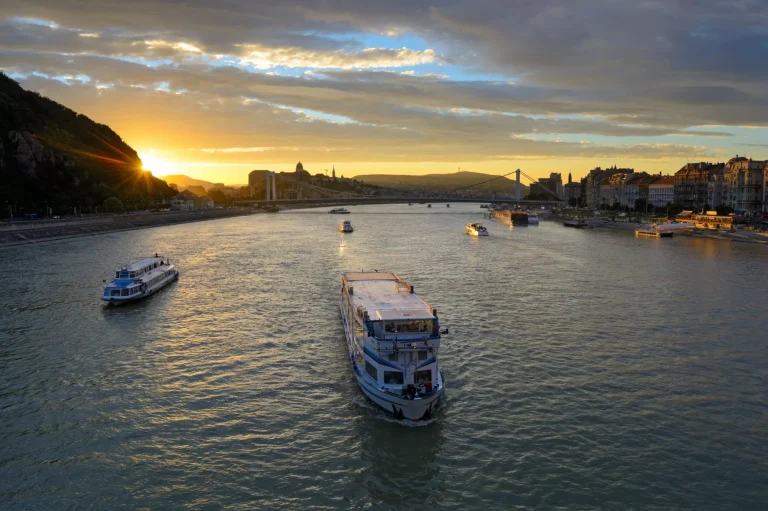 Cruise boat on Danube river at sunset, Budapest