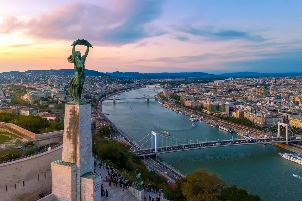 Budapest at sunset with the Danube and its bridges seen from Gellért Hill
